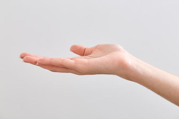 Empty female hand on white