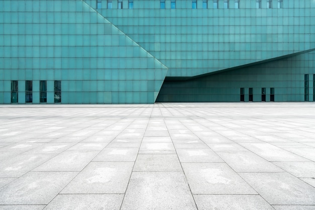 The empty floor of the square and the exterior walls of modern buildings