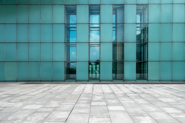 The empty floor of the square and the exterior walls of modern buildings