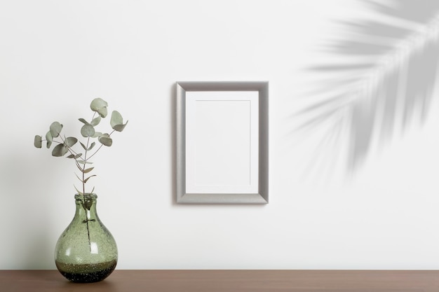 empty frame background. Empty decorative frame for a photo or painting in a light Scandinavian minimalist interior on a white clean wall.