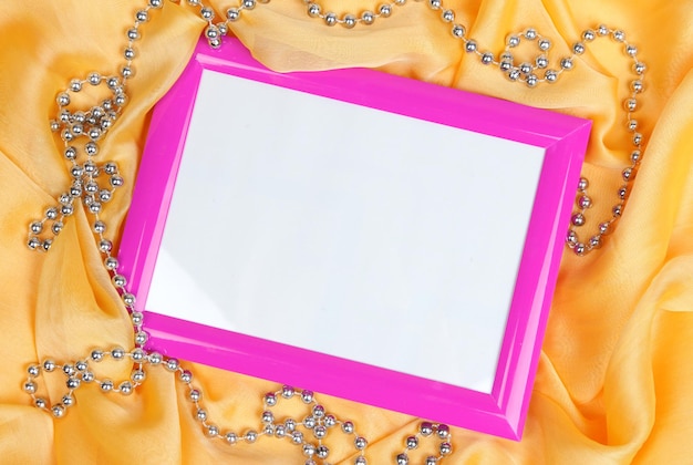 Empty frame on beautiful silk background