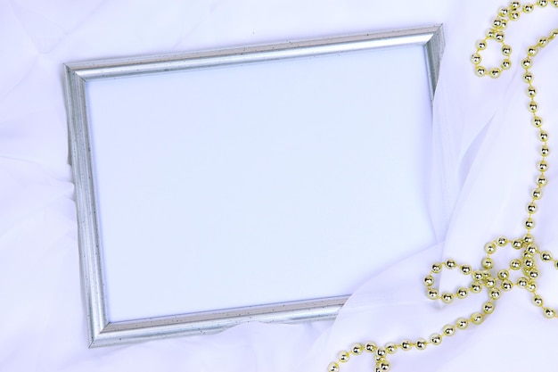 Empty frame on beautiful silk background