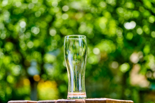 Empty glass of beer on wooden table