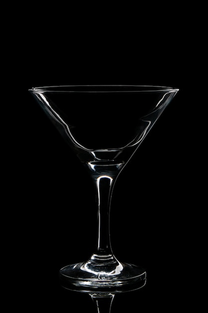 Empty glass for cocktail on a black background