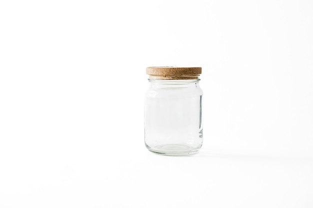 Photo empty glass jar with cork lid on white background