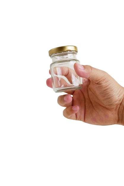 Empty glass jar with hand isolated on white