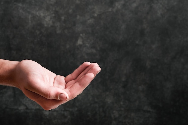 Empty hand of a poor hungry man outstretched for alms Problems with the supply of wheat and flour global food supply and hunger world crisis concept Mock up