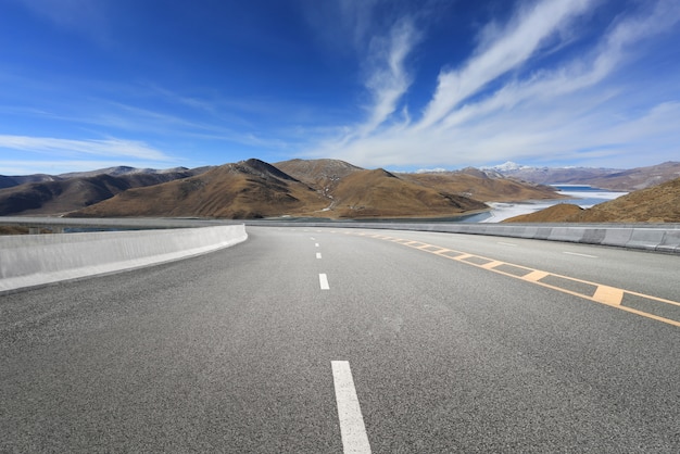 Empty highways and distant mountains