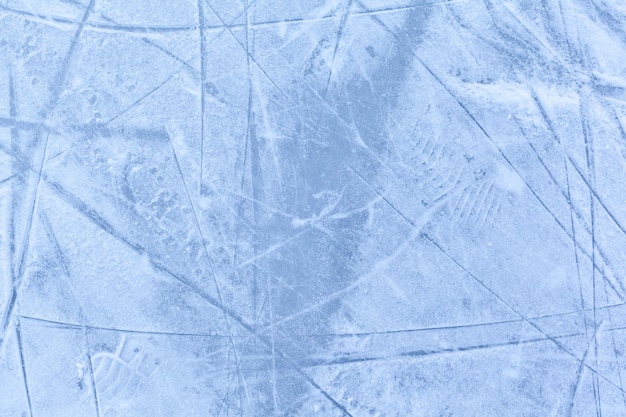 Empty ice rink with skate marks after the session outdoor skating ice rink texture covered with snow