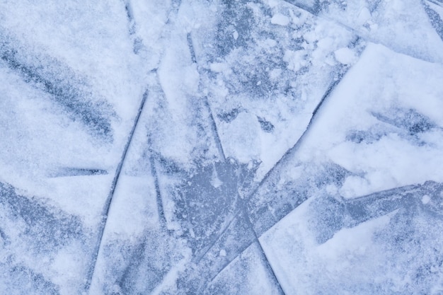 Empty ice rink with skate marks after the session outdoor.skating ice rink texture covered with snow