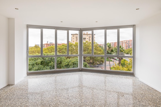 Empty interior with big panoramic window and view of cityscape in barcelona spain