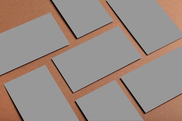 Empty invitation card or business card mockup on a brown table