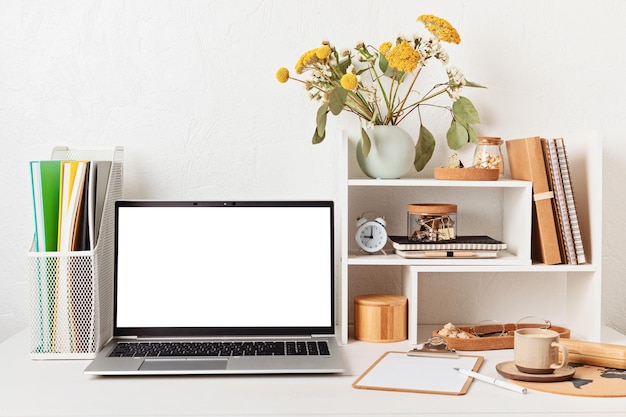 Empty laptop screen desktop organizer with desk shelves and office supplies