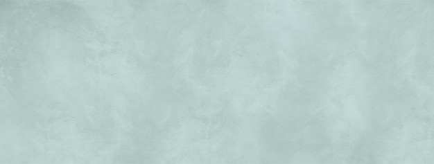 Empty light blue concrete wall background