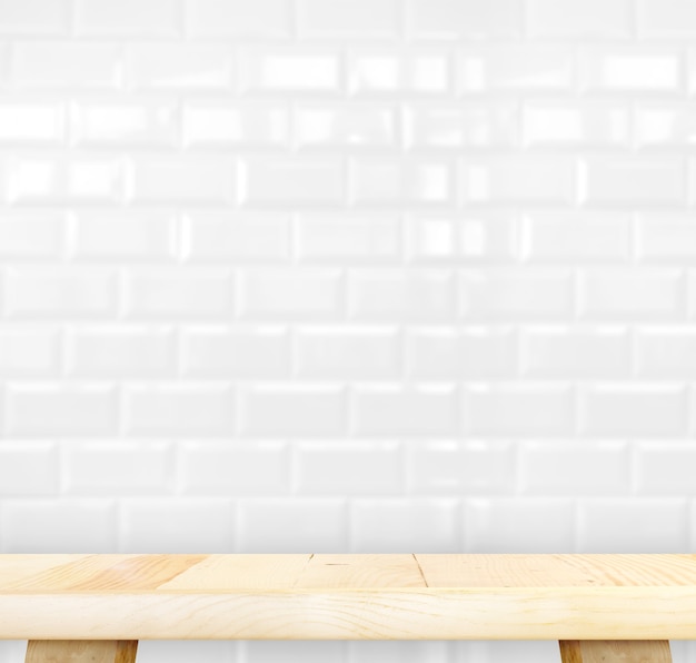 Empty light wood table and white ceramic tile brick wall in background,Mock up template for display of your product