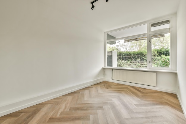 Empty living room with open kitchen