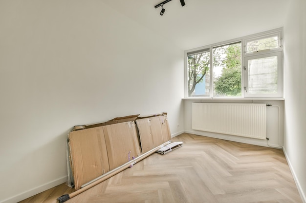 Empty living room with open kitchen