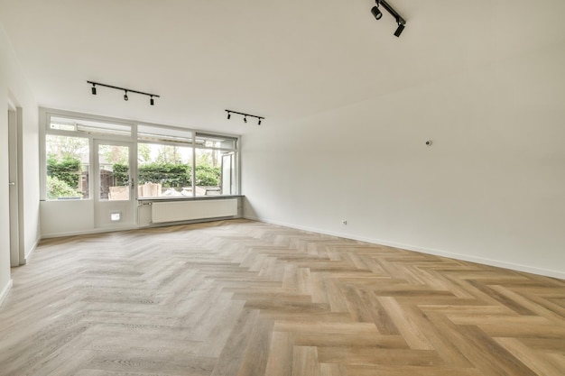 Empty living room with open kitchen