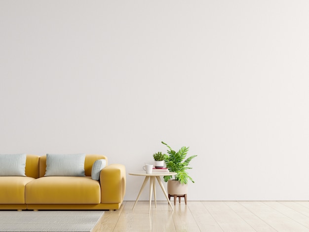 Empty living room with yellow sofa, plants and table on empty white wall background.