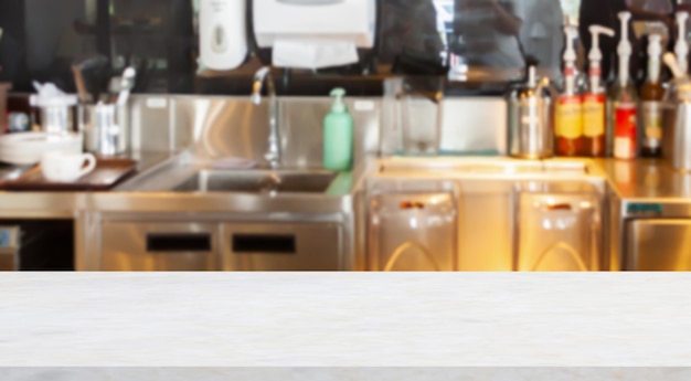 Empty marble table top with coffee shop cafe restaurant counter blur background