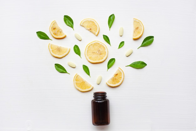 Empty medicine bottle with fresh lemon