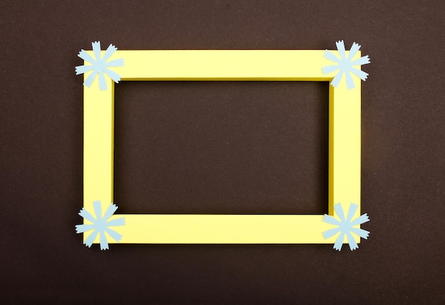 Empty mockup frame with crafting paper flowers isolated on paper background