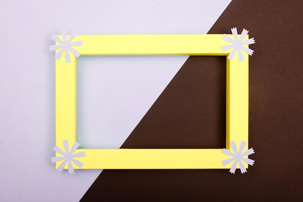 Empty mockup frame with crafting paper flowers isolated on paper background