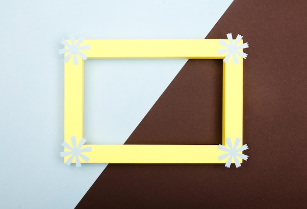 Empty mockup frame with crafting paper flowers isolated on paper background