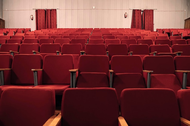 An empty movie theater during a lockdown The theater is quarantined Closing of cinemas The absence of spectators in the cinema Red empty chairs in the theatre