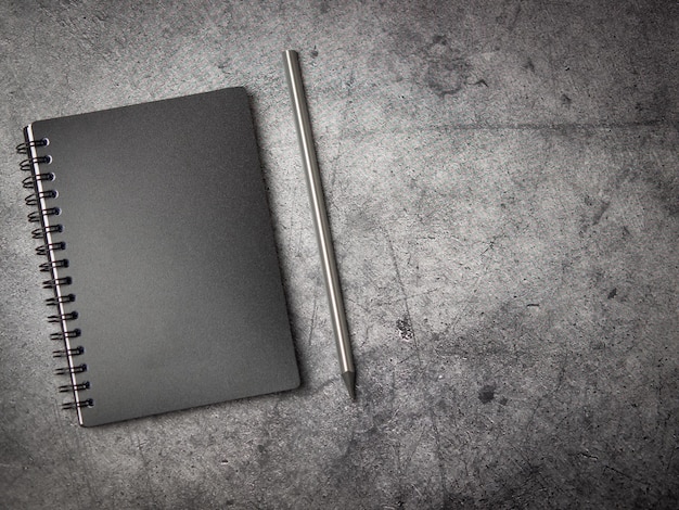 Empty notebook on gray concrete background with space for text