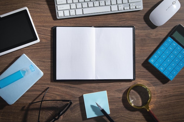 Empty notepad, computer keyboard and other business objects.