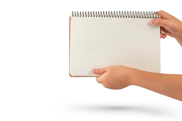 Empty notepad in hand A hand holds a blank notepad with copy space isolated on a white background