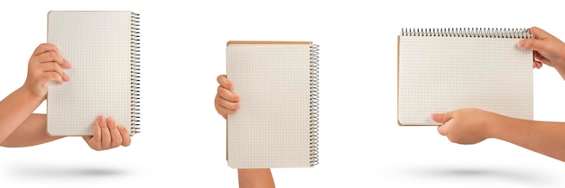 Empty notepad in hand A hand holds a blank notepad with copy space isolated on a white background