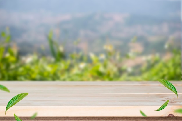 Empty old wooden table in front of blurred beautiful view forest mountain and cloud over the sky on clear day Can be used for display or montage for show your product