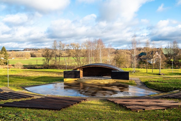 Empty open air stage in a park with a sound projecting roof