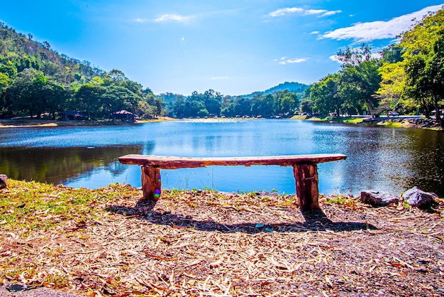 Empty park benchon Lake Nipissing during a beautifully colourful spring