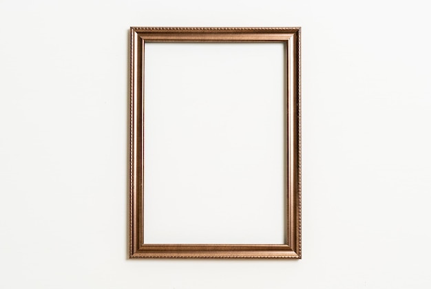 empty picture frame on white wall background with copy space