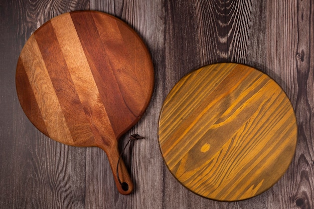 Empty pizza board on rustic wooden table Top view image