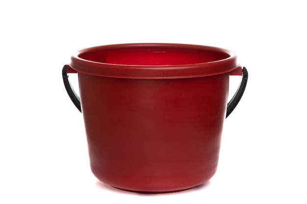 Empty plastic burgundy bucket with black handle isolated on white background