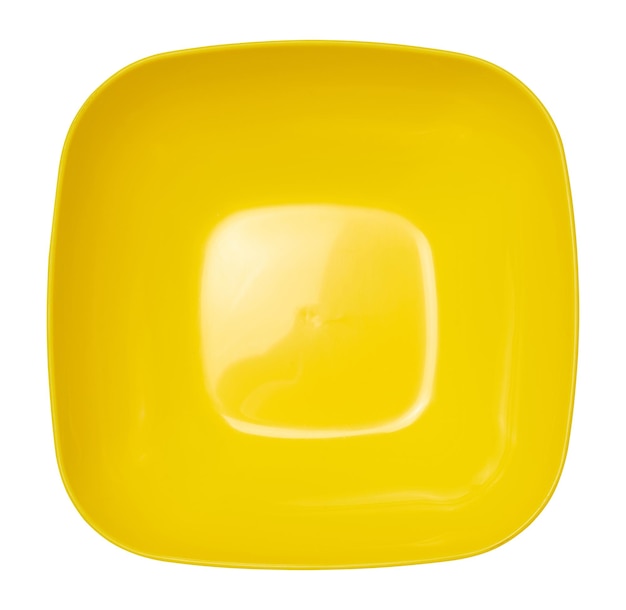 Empty plastic yellow plate on white isolated background top view