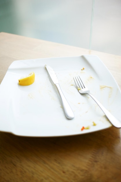 Empty plate after eating on table