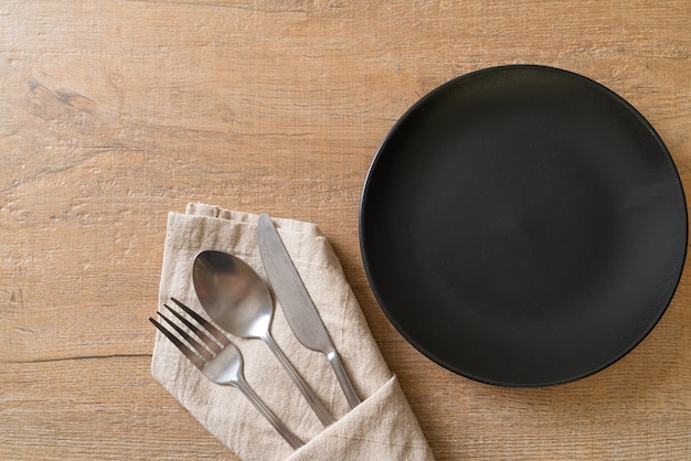 Empty plate or dish with knife fork and spoon