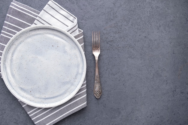 Empty plate with fork Top view Copy space