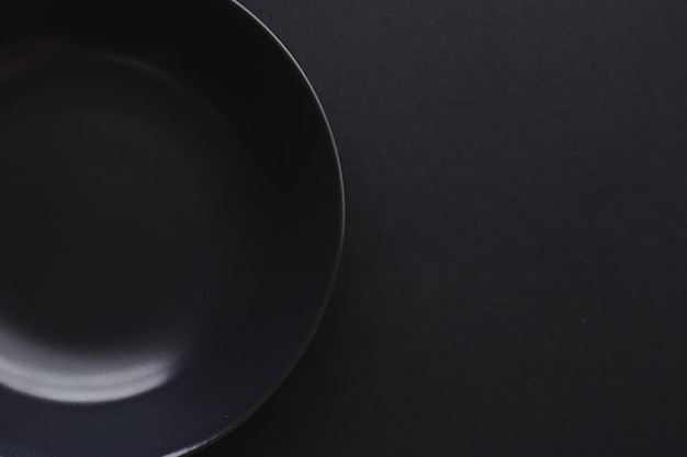 Empty plates on black background premium dishware for holiday dinner minimalistic design and diet