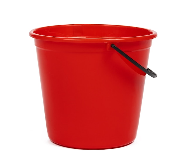 Empty red plastic household bucket on a white background