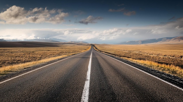 an empty road with a mountain in the background