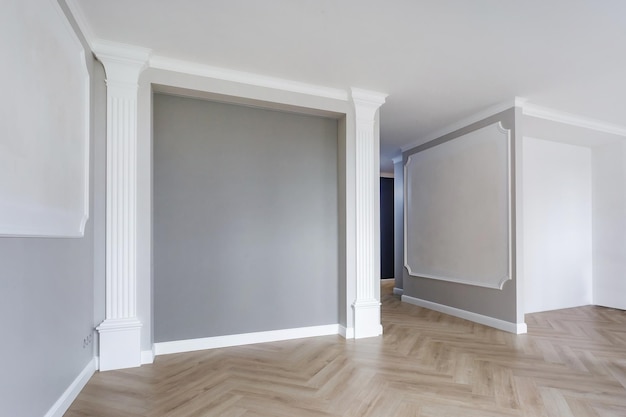 Empty room with minimal preparatory repairs with crown molding interior of white and gray walls