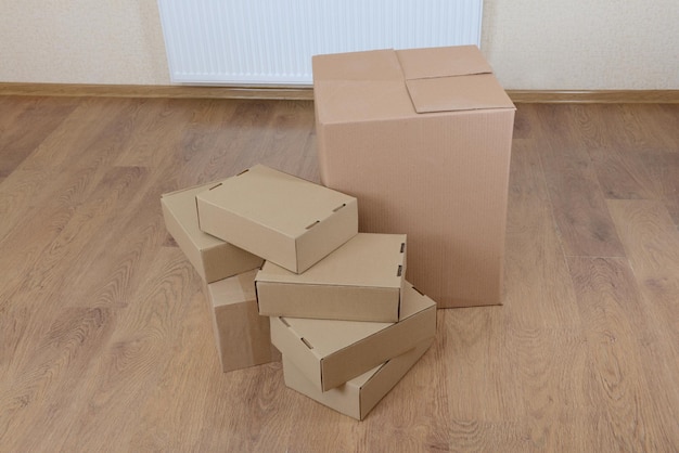 Empty room with stack of cartons moving house concept