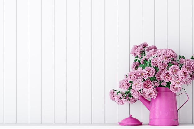 Empty room with a white wall mockup and pink flawers