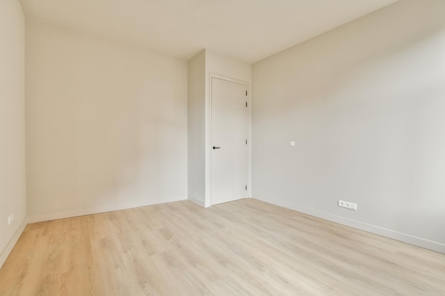 Empty room with white walls and parquet floor